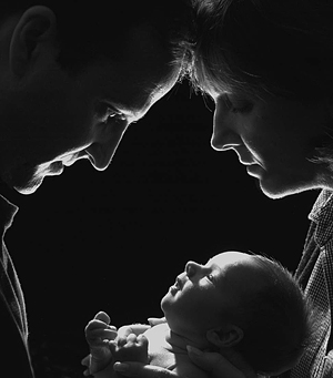 A couple and their newborn baby